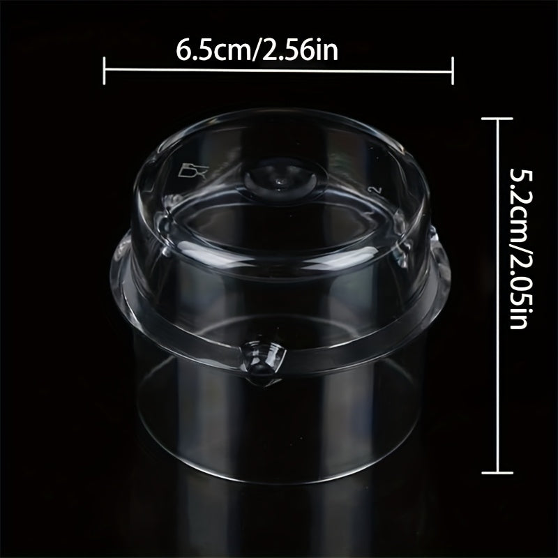 One piece of a transparent measuring cup with a plastic liquid addition cover and stirring pot cover, suitable for use with food grade mixers. Capacity: 100mL.