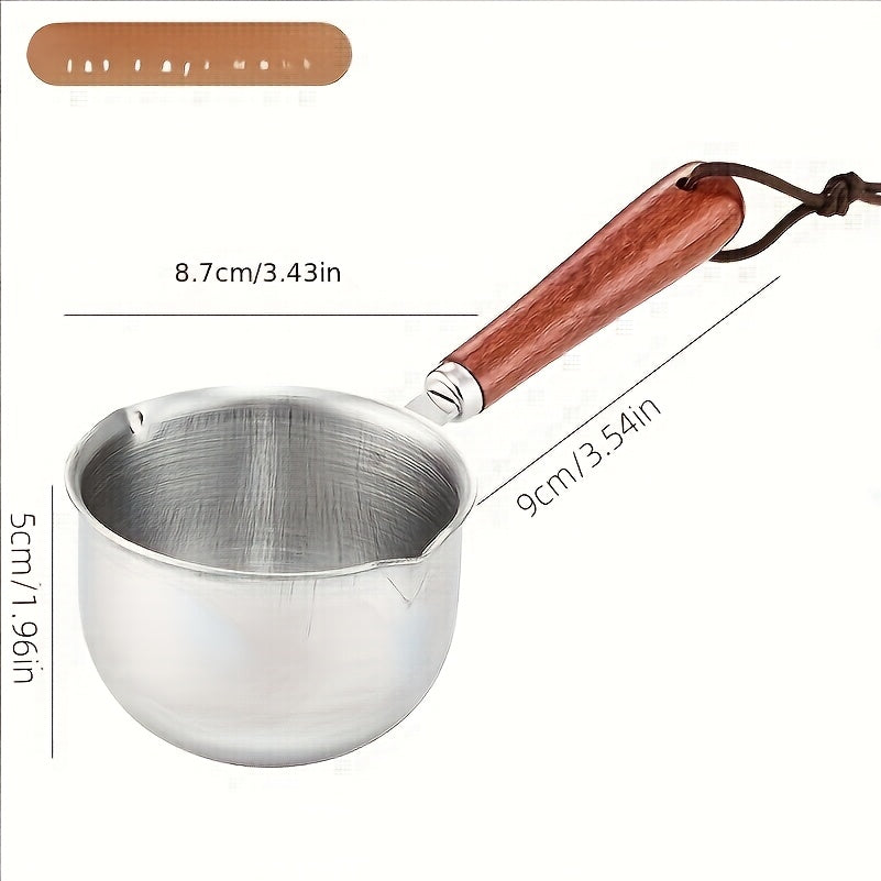 Small saucepan made of stainless steel with a wooden handle, perfect for pouring hot oil or serving soup and sauce, featuring a measuring spout for accuracy.