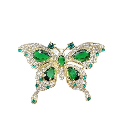 Elegant Vintage Emerald Rhinestone Butterfly Brooch Pins - Set of 2. These Hollowed-Out Alloy Lapel Pins are perfect for women and can be worn as Clothing Accessories on Wedding Party Dress, Scarf, or Shawl. Ideal for adding a touch of sophistication to