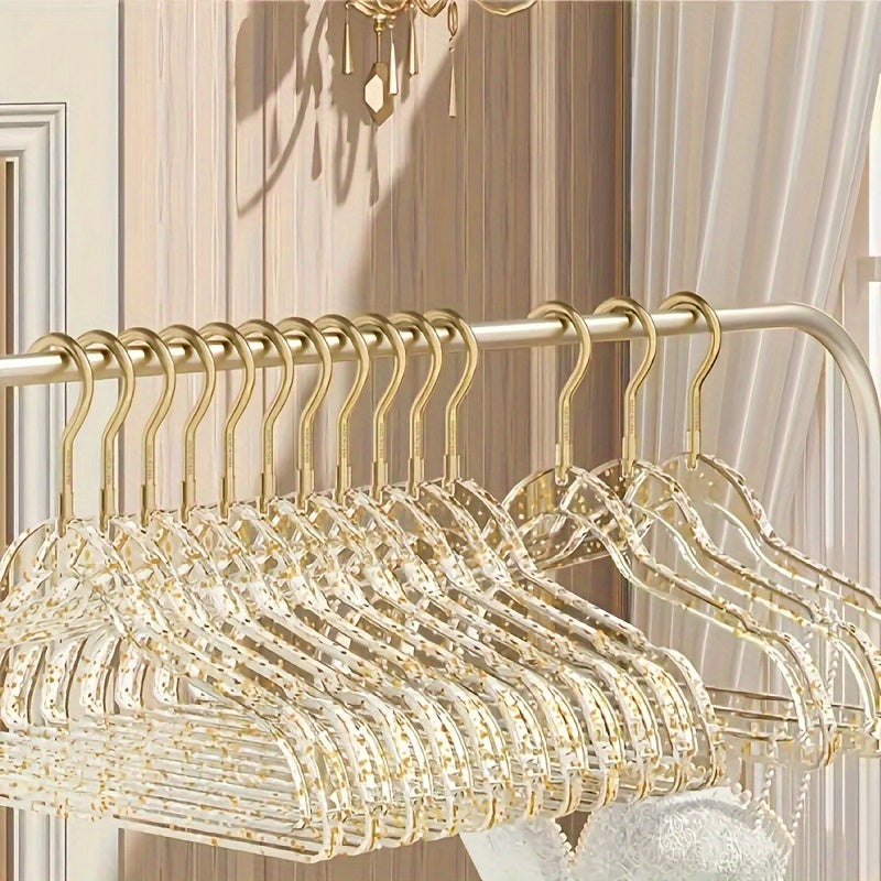 A set of 12 premium acrylic hangers with a non-slip, sparkling transparent design, providing a firm grip for wardrobe storage. These durable, thick hangers are perfect for bedroom closets, offering a traceless hanging solution.