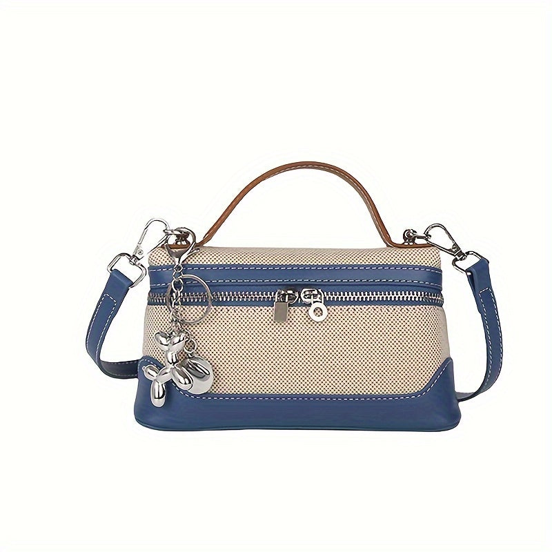 Retro-inspired mini crossbody bag for women in colorblock design, with adjustable strap and zip closure in black/blue/dark red/light brown/orange.