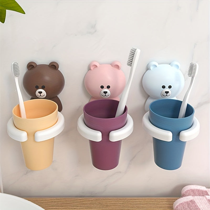 Wall-mounted bear toothbrush holder with cup - no drilling, space-saving bathroom organizer.