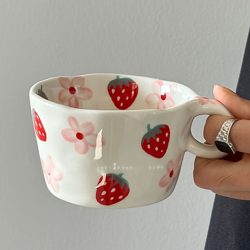 Unique hand-painted ceramic mug with a charming strawberry and floral design, perfect for coffee or tea. Ideal Valentine's Day gift, reusable and high-quality, featuring an irregular art style.