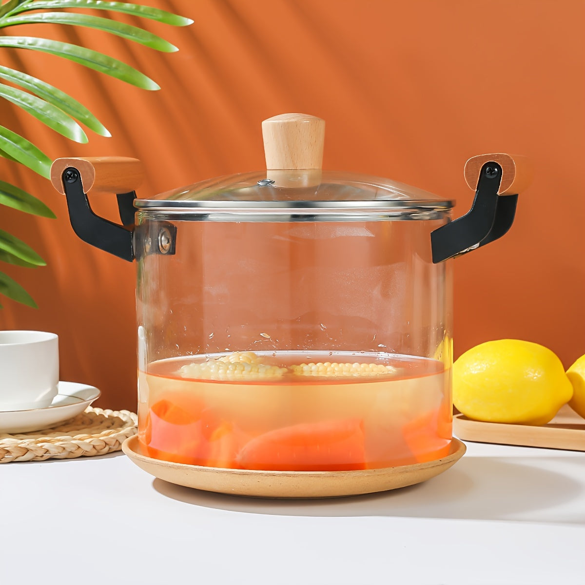 Glass saucepan with lid, 4.5L capacity perfect for noodles, soup, and milk. Made of high borosilicate material with dual wooden handles. Compatible with gas stovetop and features a transparent design for easy cooking. Ideal addition to any kitchen.