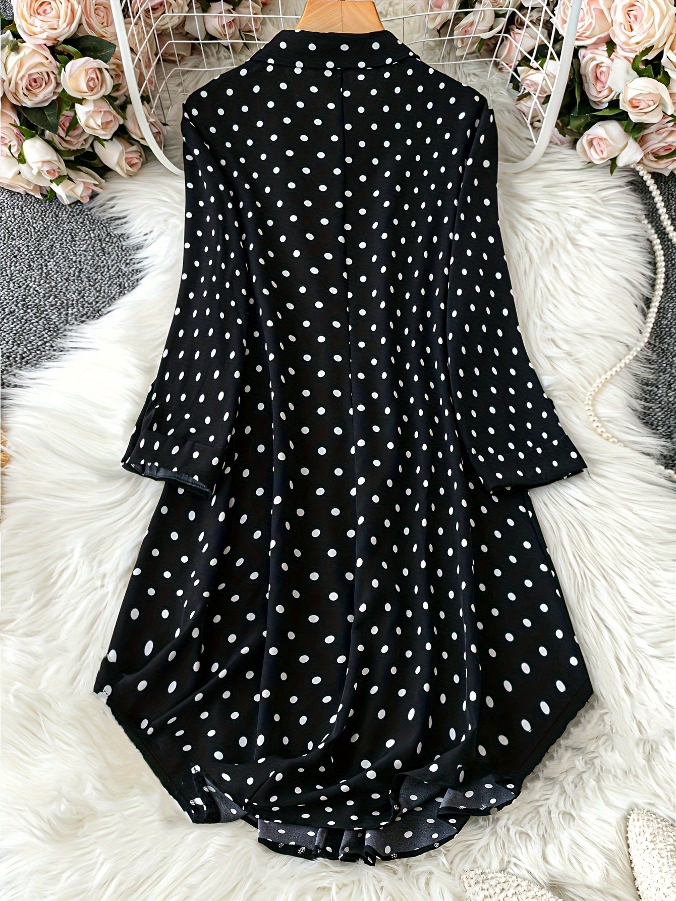 Polka dot print dress with button front and long sleeves for plus size women.