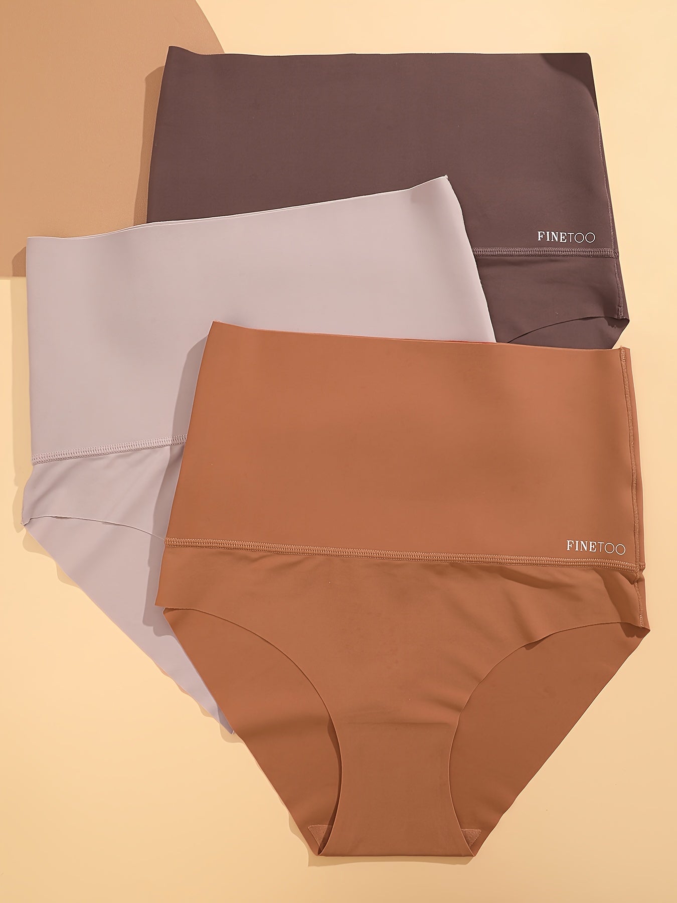 Three seamless solid briefs with high waist design, made of breathable and stretchy material, perfect for women's lingerie and underwear.