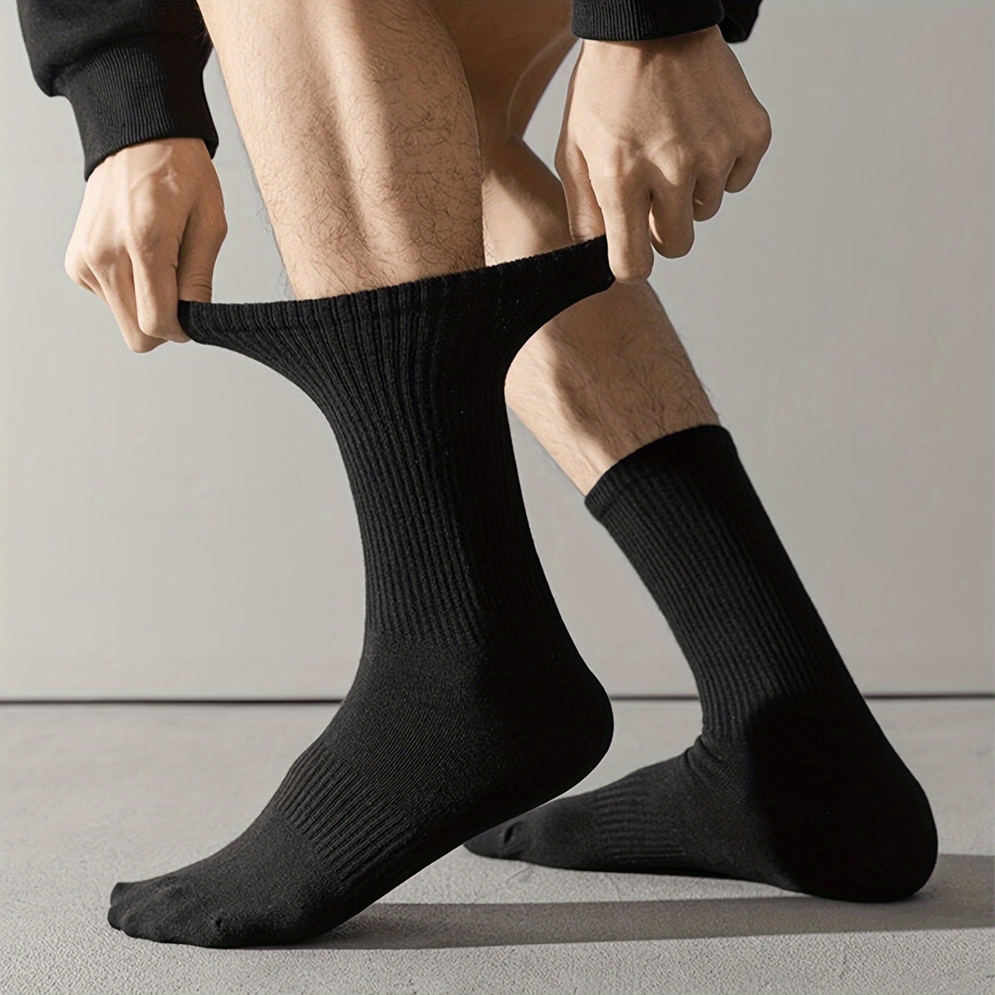 20 Pairs of solid color, mid-calf unisex socks made of 100% polyester. Comfortable soft knit fabric. Machine washable. Lightweight at 89 gsm, ideal for layering.