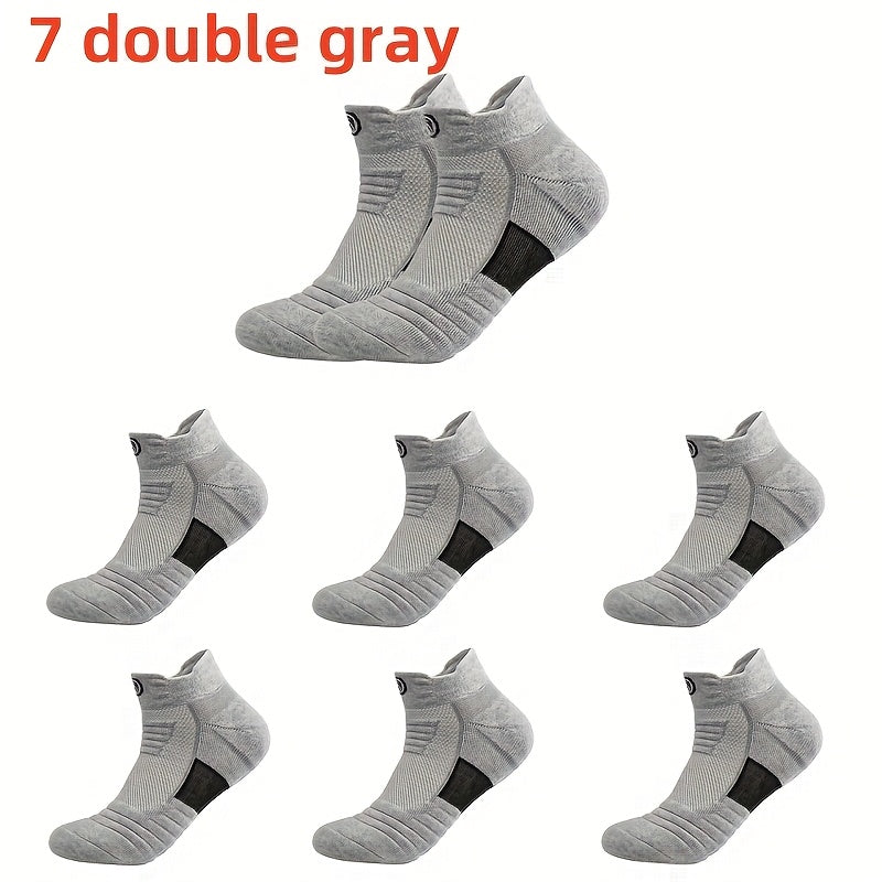 5 pairs of high-performance athletic compression socks for men in gray, black, and white. Made with breathable polyester and sweat-wicking material with a towel bottom, featuring a