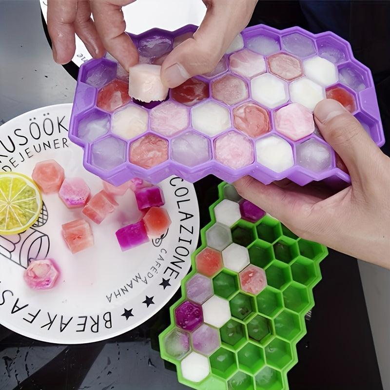 The Silicone Honeycomb Ice Tray is designed with 37 compartments and a lid for easy storage. Made of durable silicone, this tray is perfect for creating hexagonal ice cubes and can also be used for making chocolate, wax bottles, and candy. The flexible