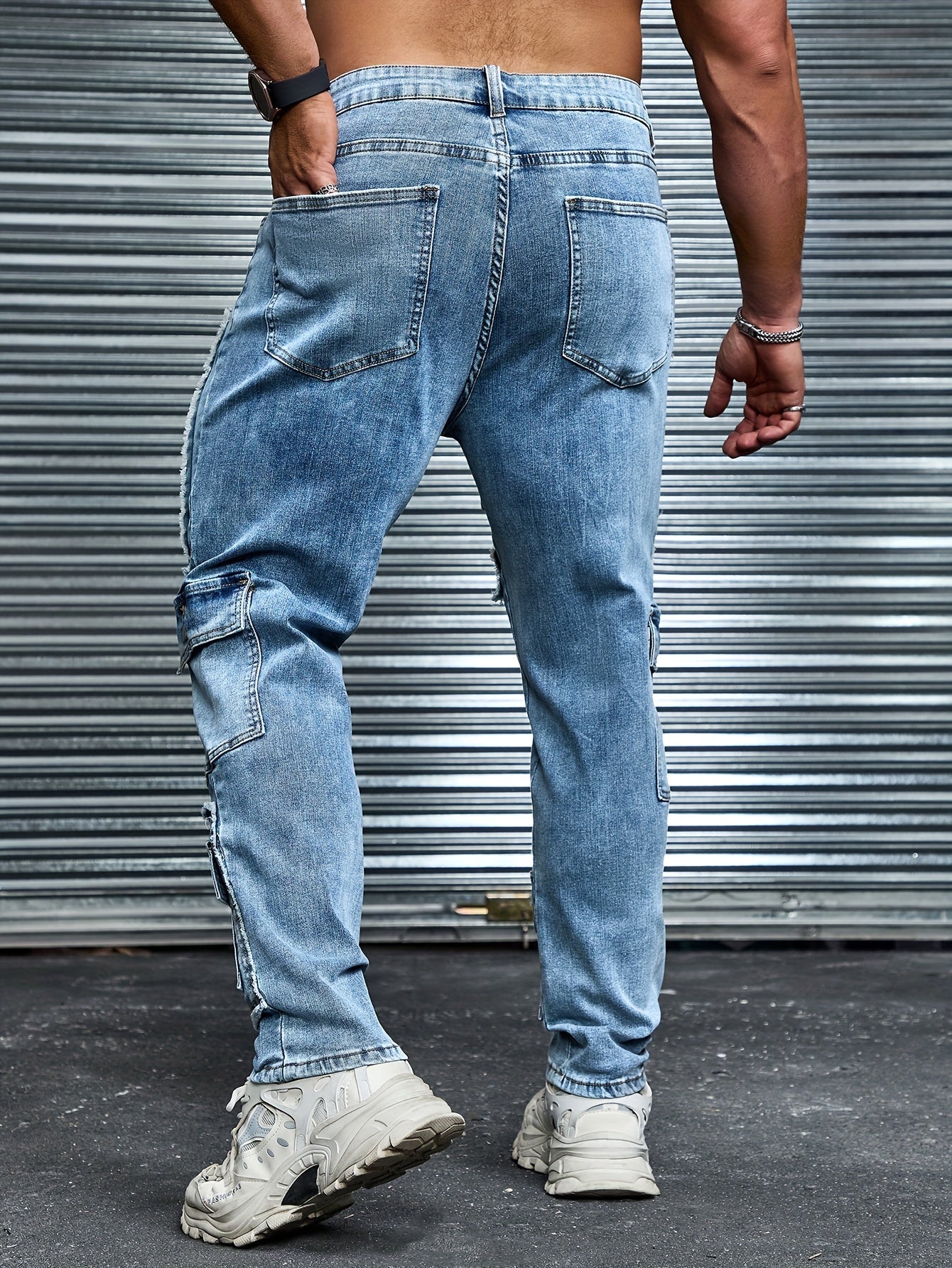 Plus size men's denim jeans with multiple pockets, distressed style, and comfort fit for everyday wear.