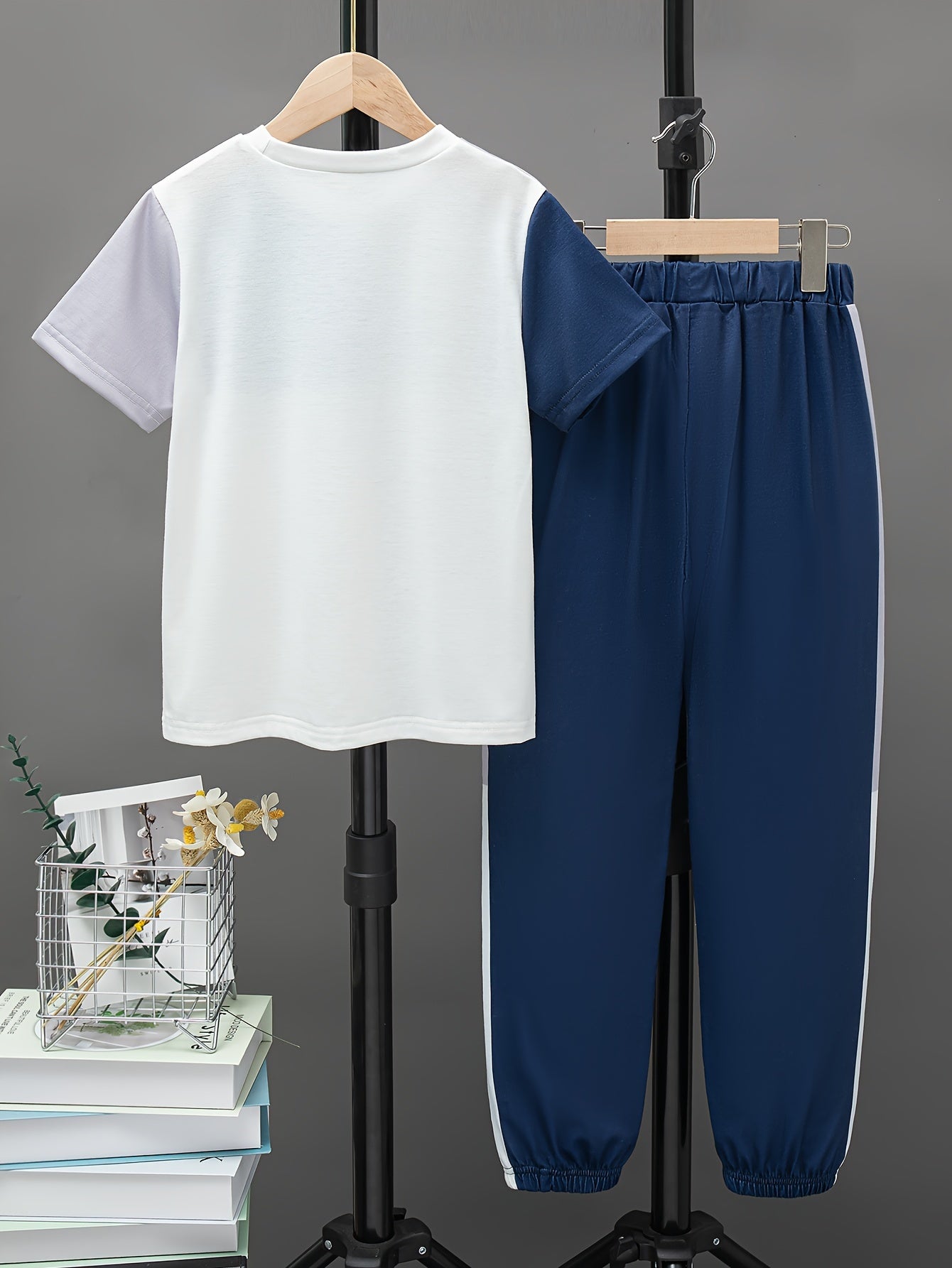 Boys' summer casual outfit: Round neck short sleeve top with contrast design and trousers set, ideal for outdoor activities.