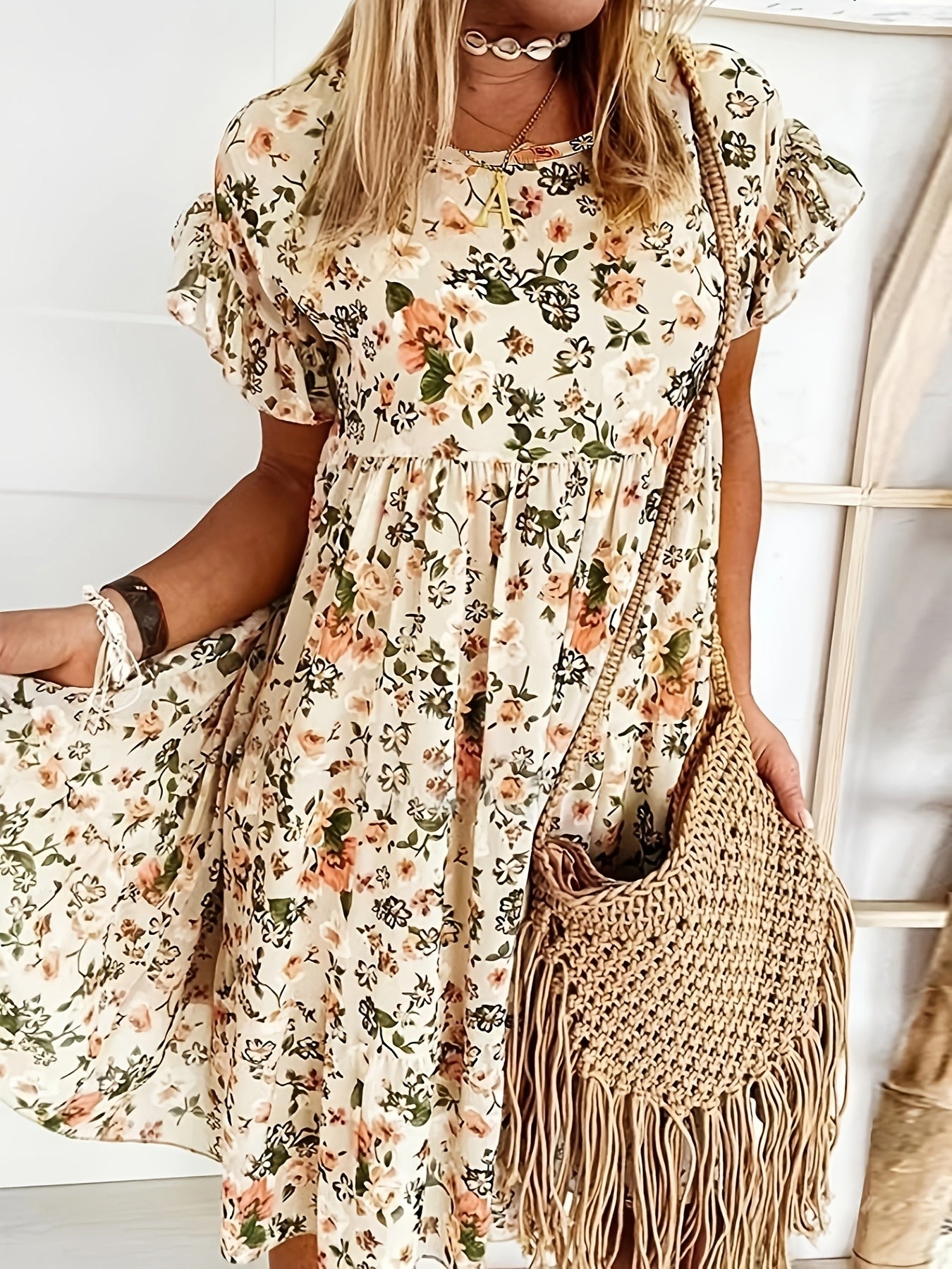 Elegant floral print plus size dress with ruffle detail. Navy blue with pink flowers, perfect for spring and summer. Casual chic style.