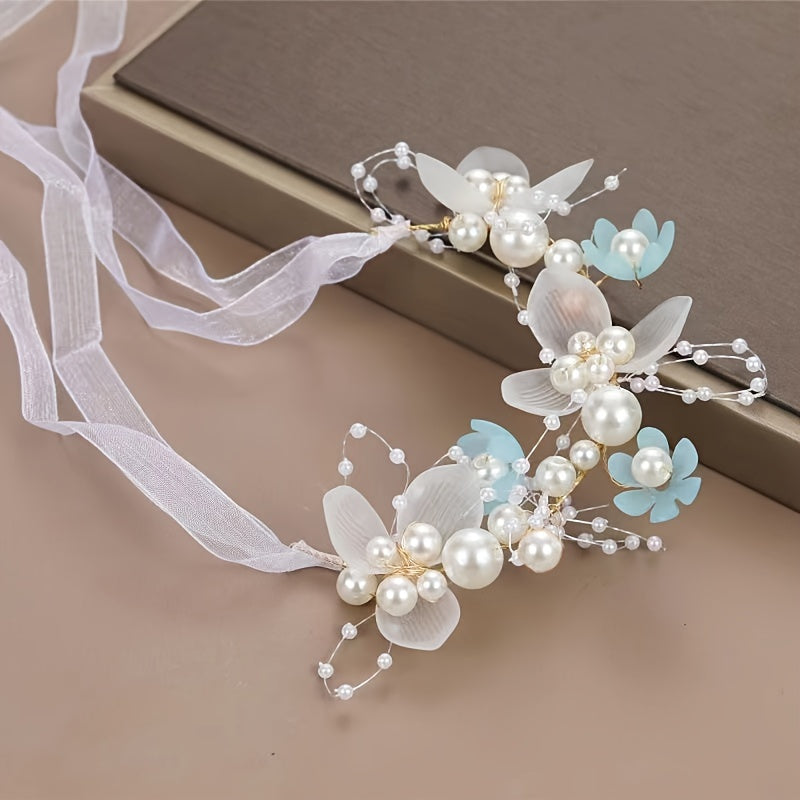 Romantic bridal headpiece with faux pearls, floral wreath, and ribbon tie.