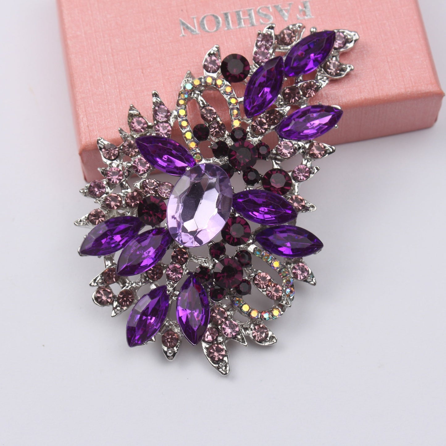 Crystal embellished fashion accessory - vintage rhinestone brooch pin featuring an irregular flower design