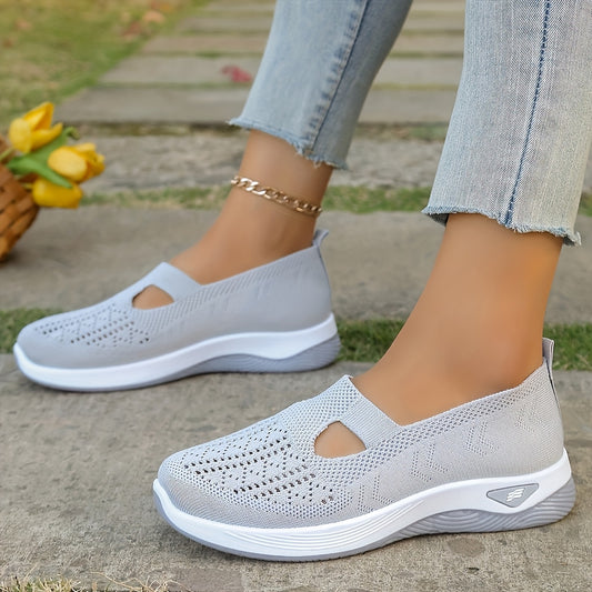 Breathable mesh slip-on sneakers with PVC sole, fabric insole, and lining for stability and comfort. Perfect for casual outdoor wear in spring and summer. Features cut-out patterns and