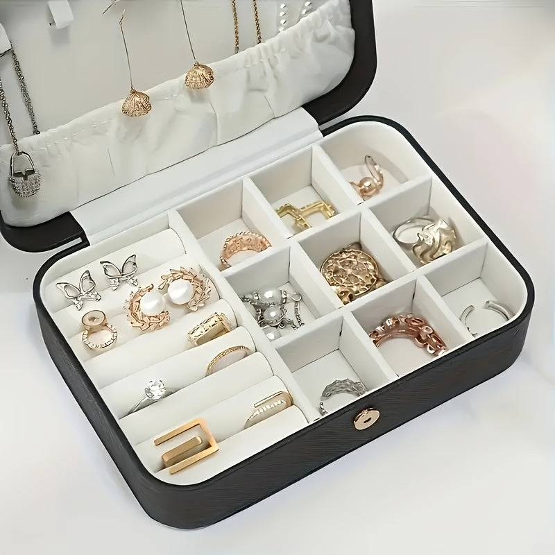 Stylish faux leather jewelry organizer for traveling with rings, necklaces, and earrings. Features zip closure and soft interior.