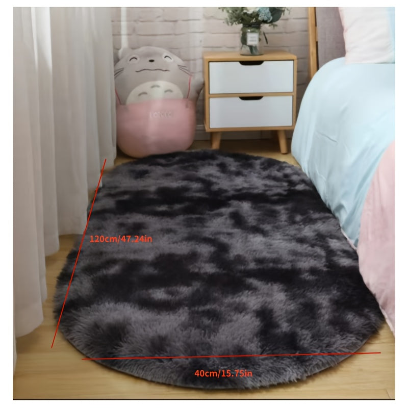 Soft faux fur oval area mat that is luxurious, plush, non-slip, hand washable, and durable. Perfect for adding a touch of elegance to your bedroom, living room, or home decor. Available in two sizes.