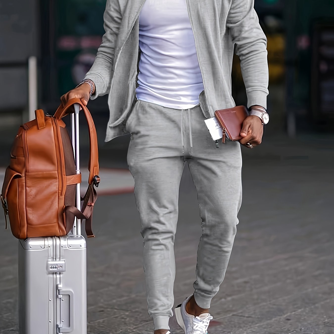 Men's travel-friendly sporty tracksuit set with long sleeve zip-up jacket and joggers, perfect for leisure and outdoor activities. Made of polyester.