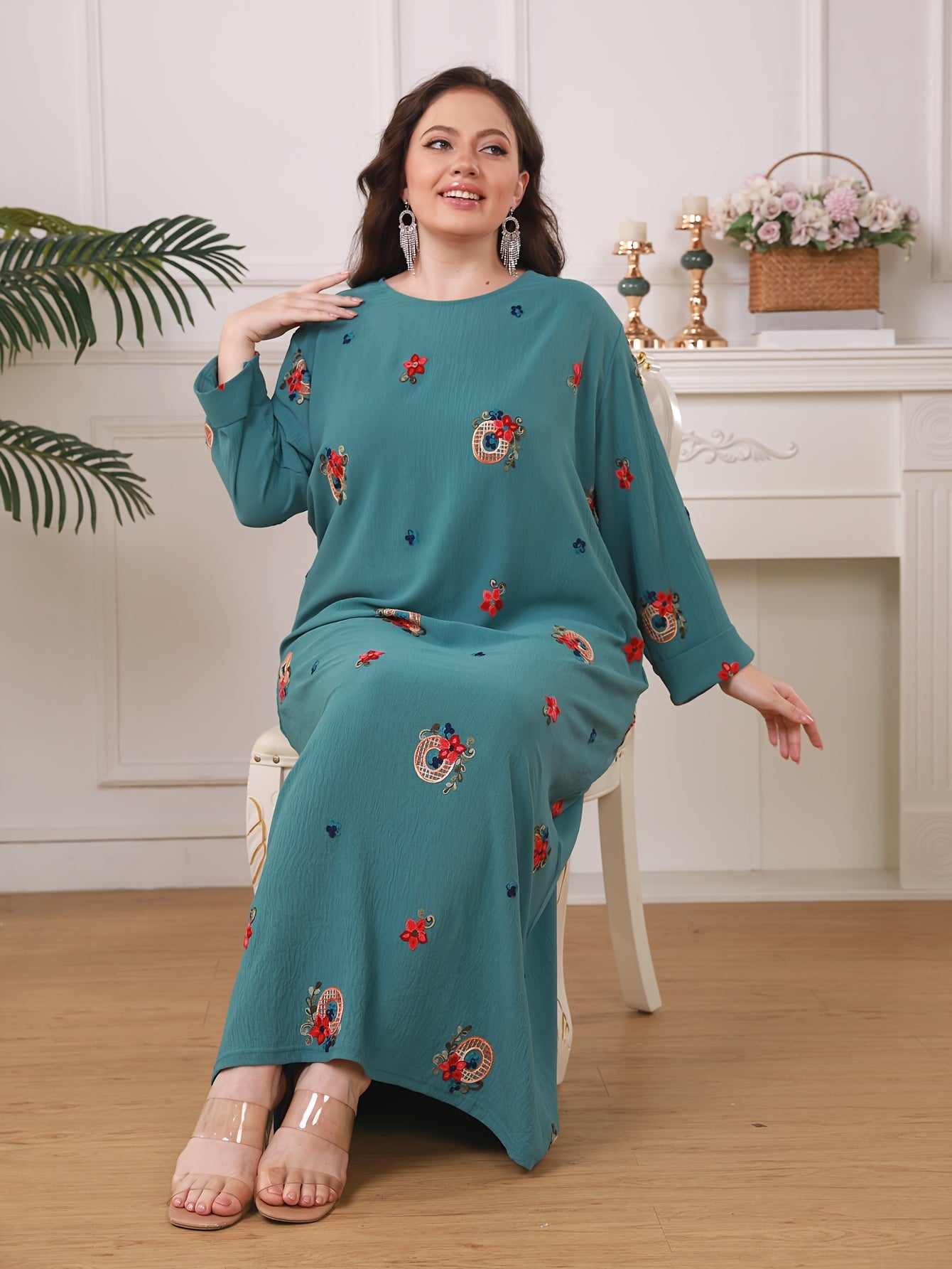 Elegant floral print women's plus size abaya with long sleeves and loose fit in traditional Middle Eastern style.