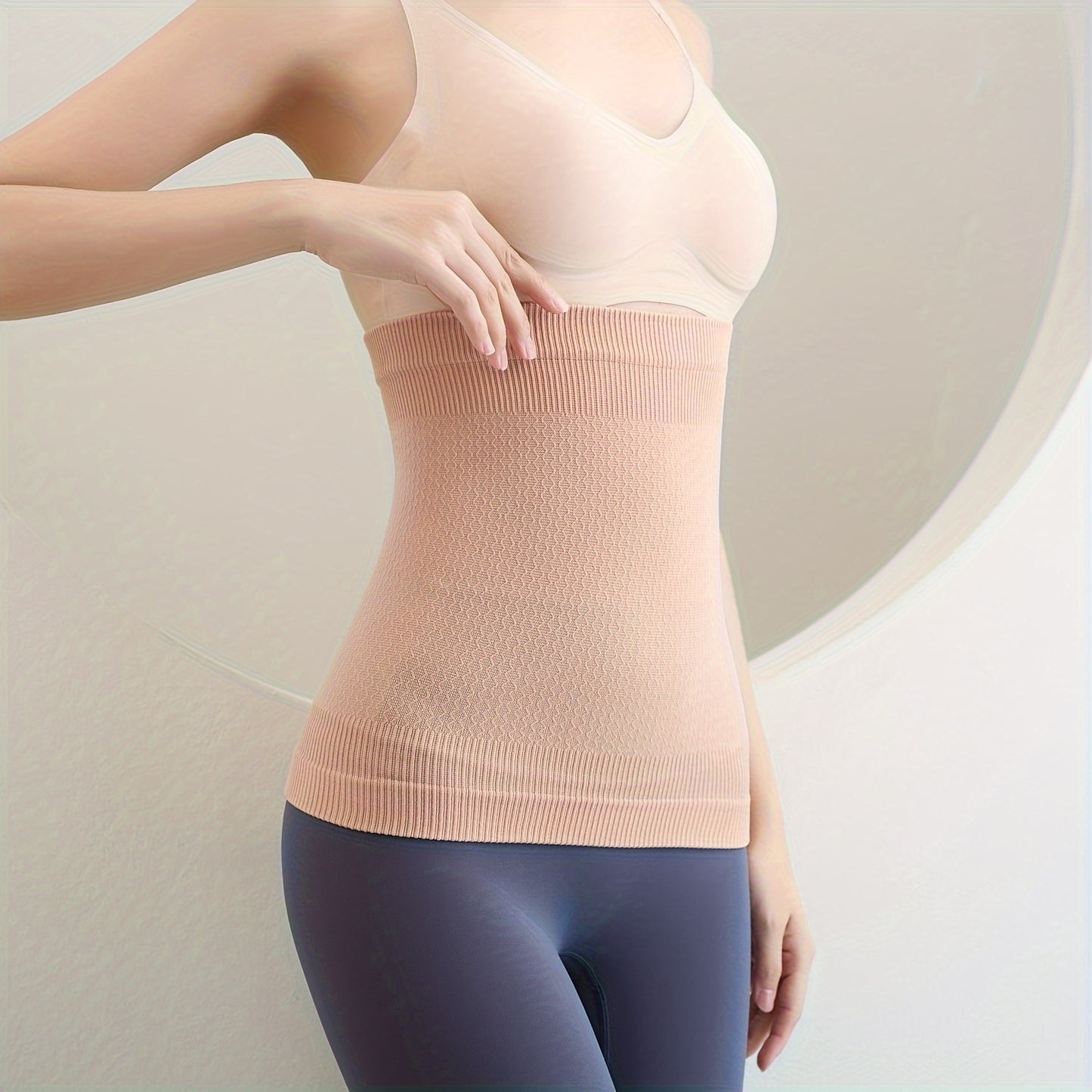 Seamless waist trainer for women, shapes and controls tummy.