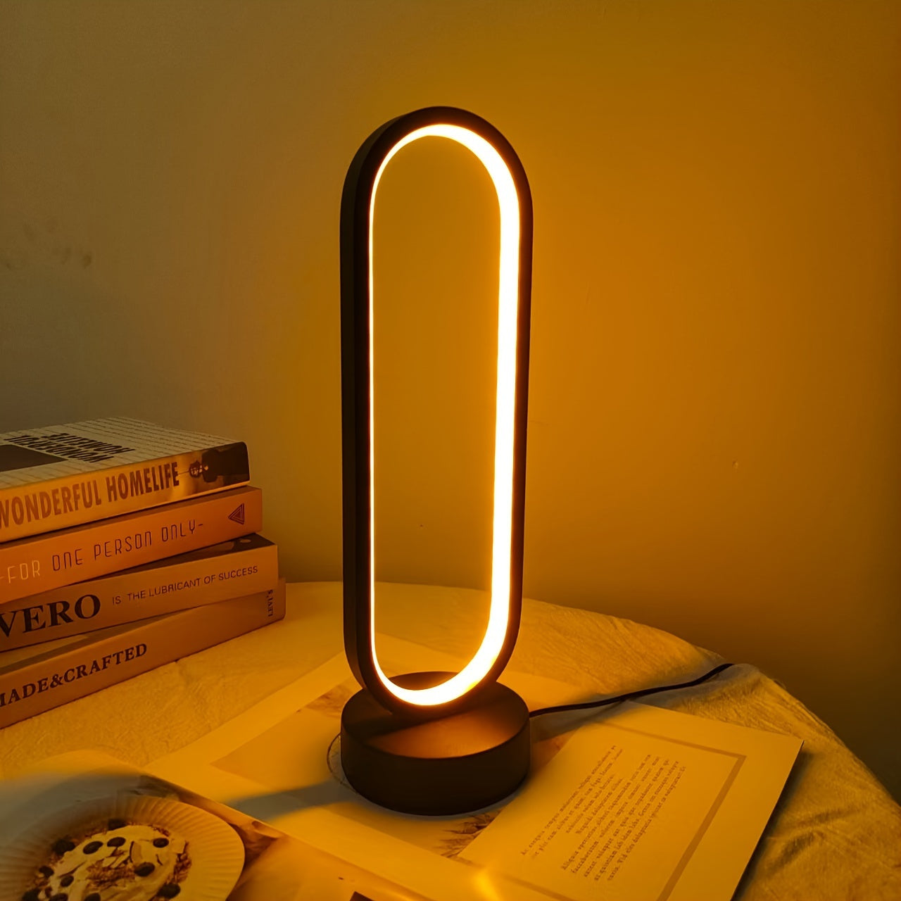 USB-powered LED ring table lamp in black or white; dimmable for bedroom and living room decor.