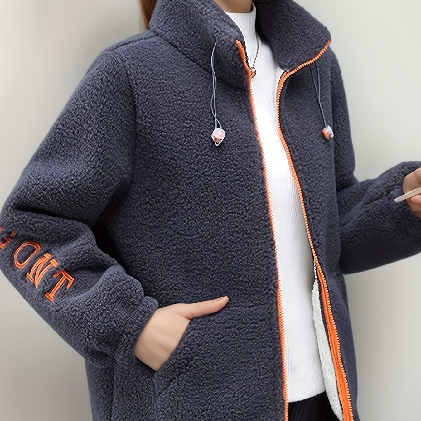 Cozy fleece-like jacket for women with embroidered letters in warm red velvet, perfect for all seasons. Cute and casual with a stand collar, long sleeves, and fleecelike texture.