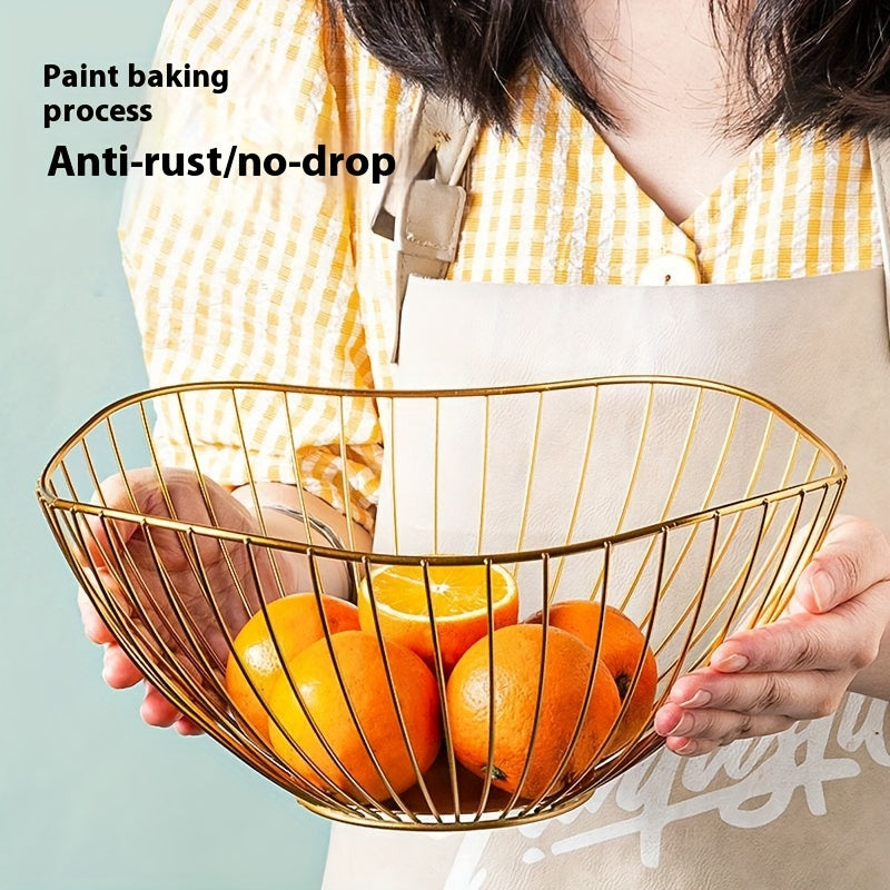 Rust-resistant golden metal wire fruit basket with non-drip mesh design, ideal for storing fruits in kitchen or living room décor.