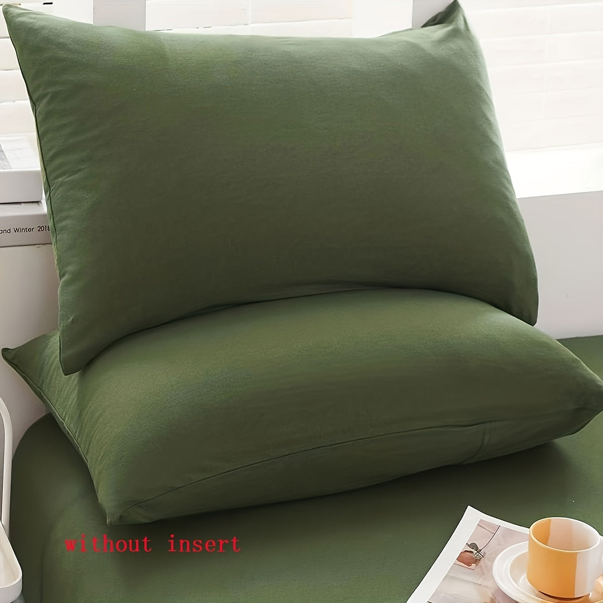 Two luxurious Army Green pillowcases made of soft brushed polyester, featuring a 100% weave. These pillowcases are machine washable and have a zipper closure for easy use. They are both elegant and durable, making them perfect bedroom accessories for