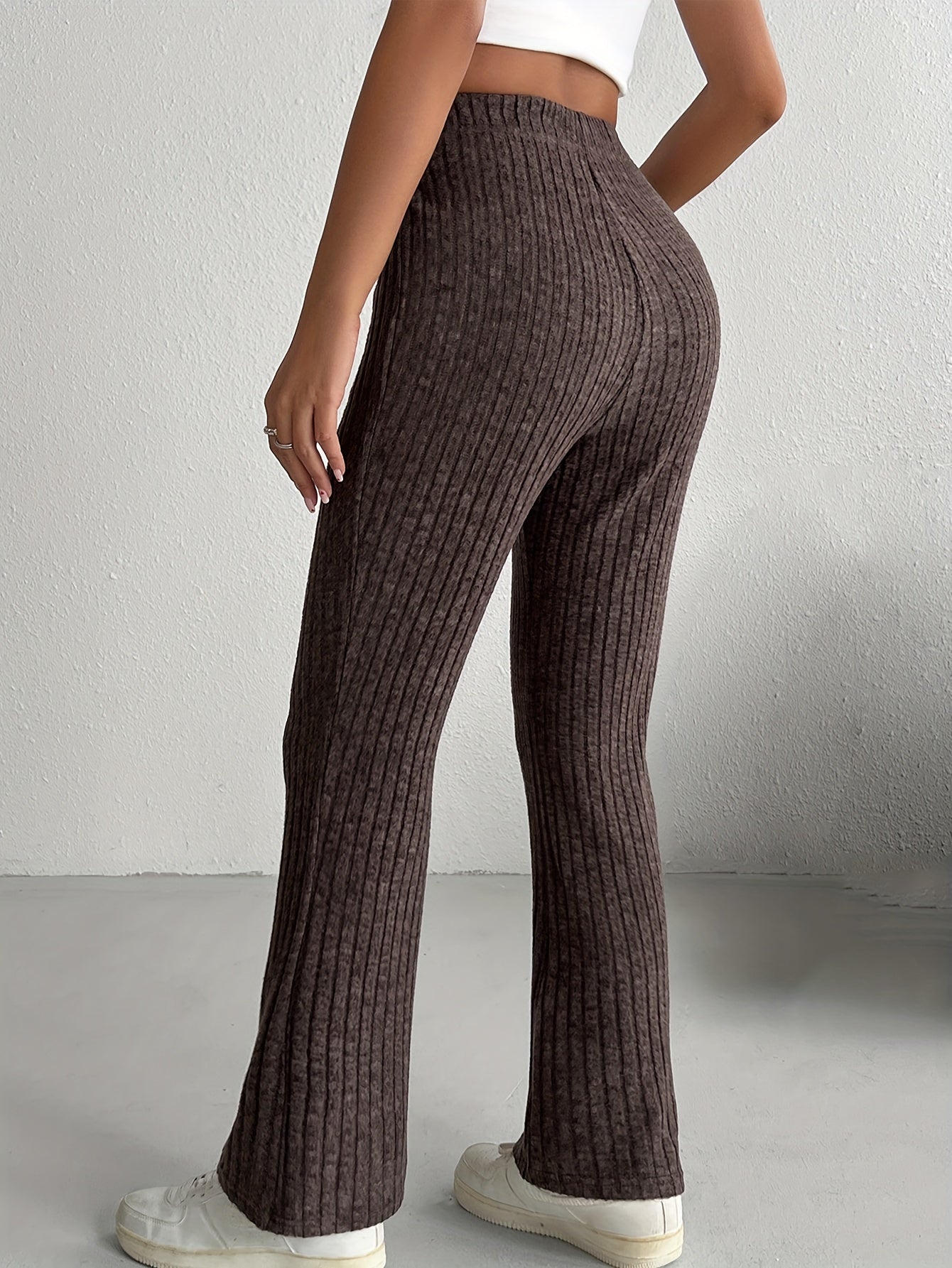 Women's elegant solid color knit flare pants made of a soft and comfortable polyester blend, perfect for all seasons, with a fabric weight of 210g/m².