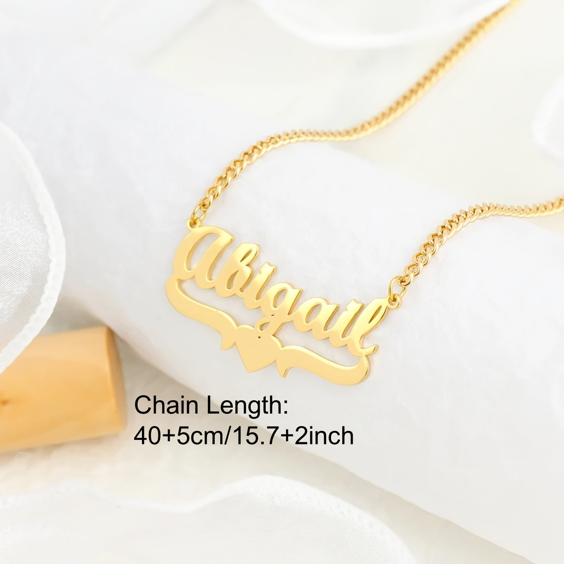 Adorn yourself with a unique 4mm Cuban link chain necklace featuring a personalized name pendant, crafted from elegant stainless steel with a heart ribbon design. This fashion jewelry for women is a versatile daily accessory that can be worn all year