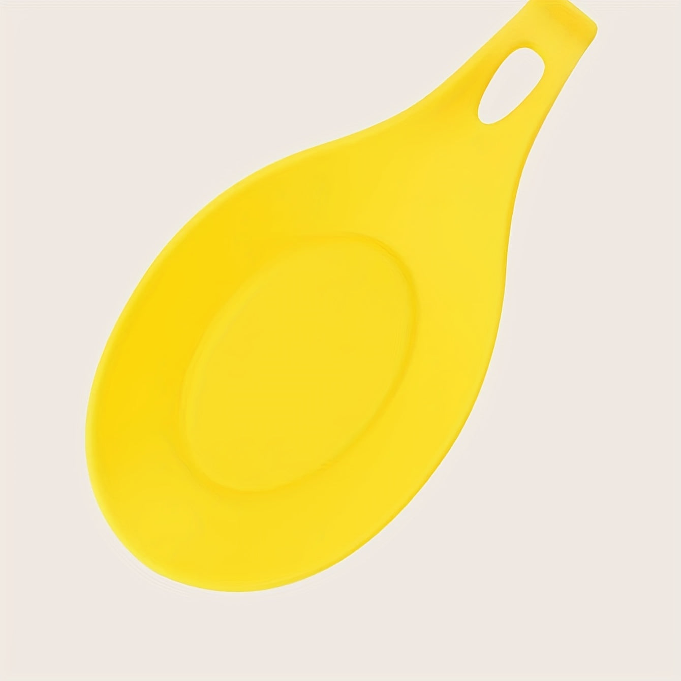 Durable, non-slip silicone spoon pad for kitchen utensils, heat-resistant and easy to clean.