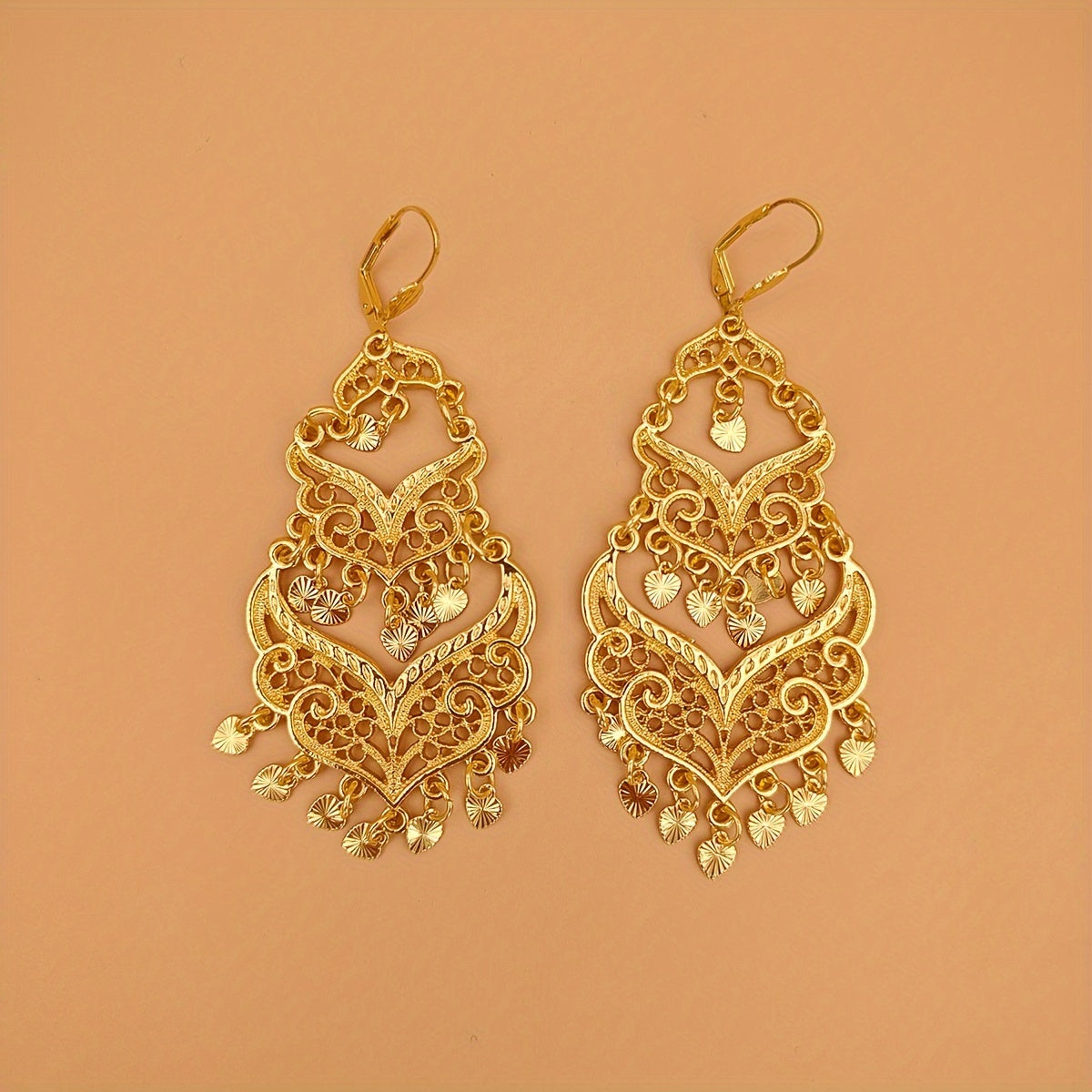 Pair of women's fashion earrings with retro large tassel and long dropping metal hollow design, perfect for banquet and festival celebrations inspired by Middle Eastern fashion.