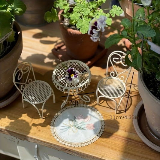 Miniature metal garden and home decor set includes waterproof iron rocking chairs, table, and wireless figurines. No power or batteries required.