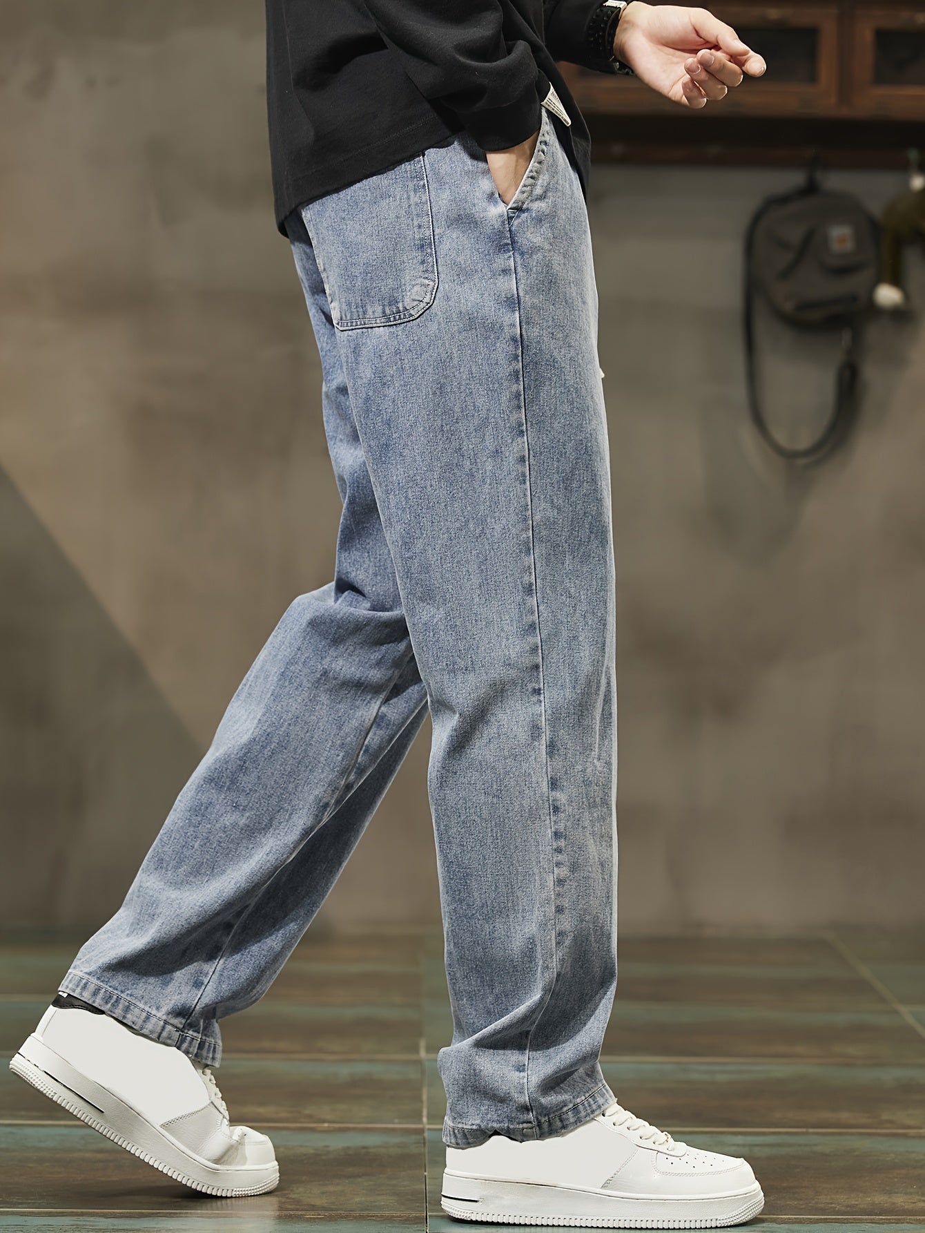 Men's denim pants with pockets, drawstring waist, suitable for outdoor activities.