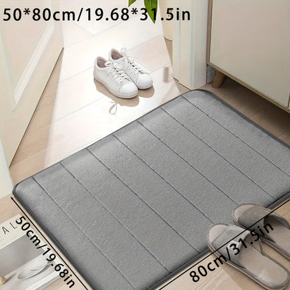 Set of memory foam bath mats, featuring ultra-soft and absorbent material with a non-slip backing. Ideal for use in the bathroom, shower, laundry room, or outdoor entrance. Made of durable polyester that is easy to clean in the washing machine. Can also