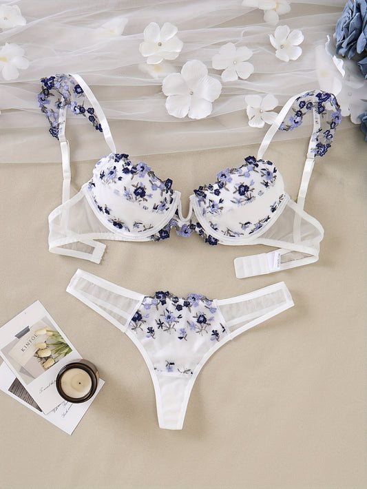 Stylish lingerie set for women with floral embroidery - padded bra and sheer thong, ideal for fall/winter.