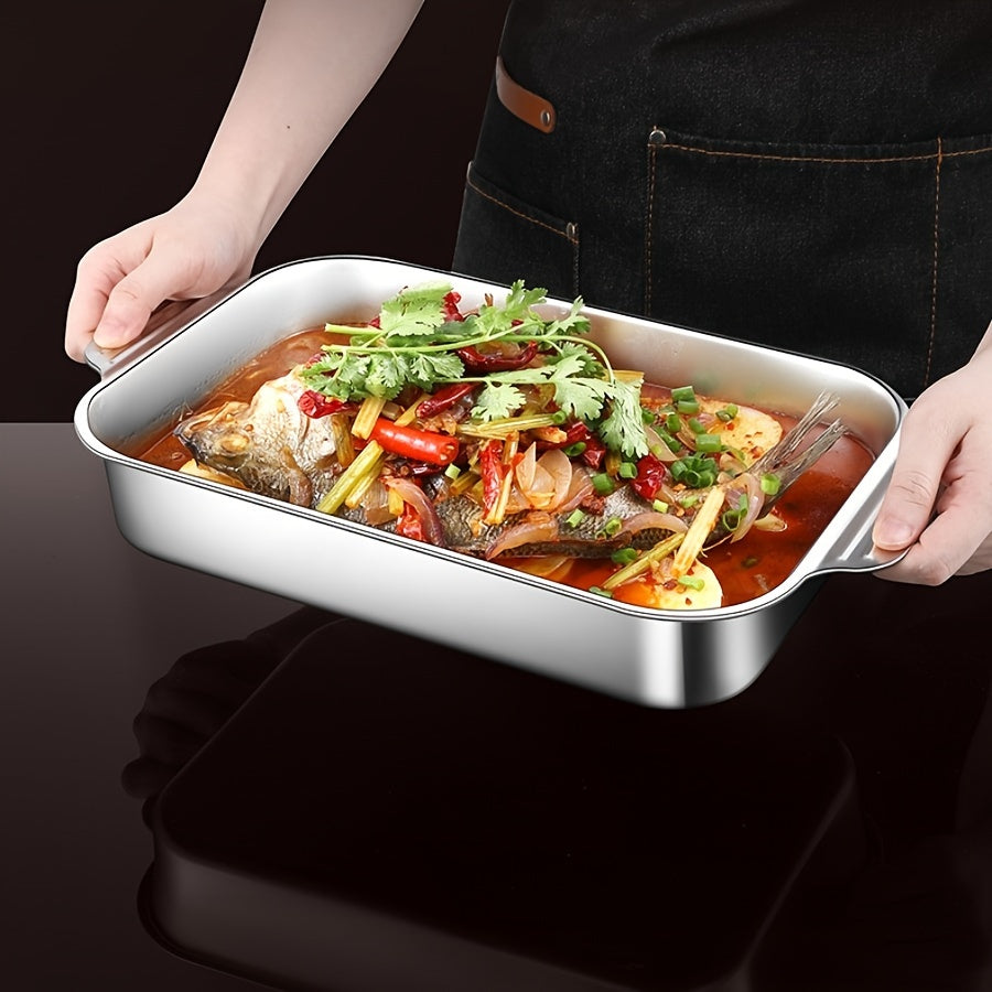 One piece of stainless steel deep baking sheet for non-stick cooking, grilling, and baking in the oven, with a selection of kitchen gadgets and accessories.