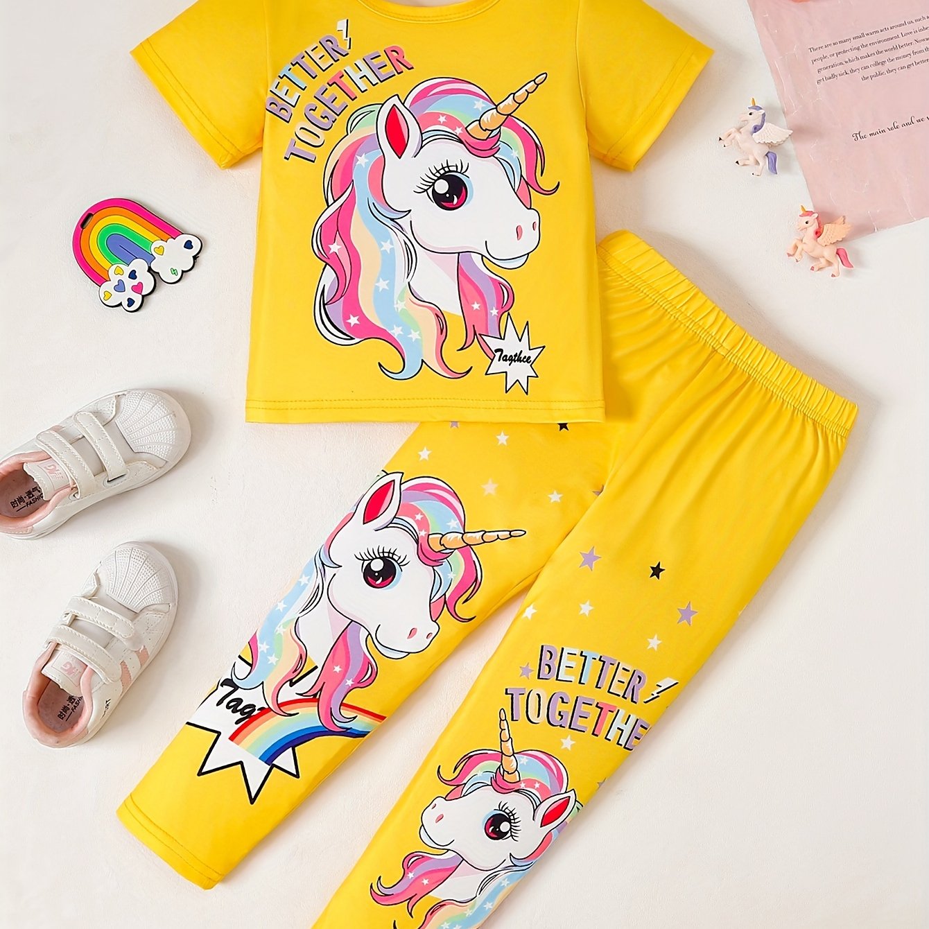 Girls' magical creature graphic t-shirt and jogger pants set. Casual outfit with animal print, regular fit, and medium stretch. Perfect for ages 3+ for outdoor activities.