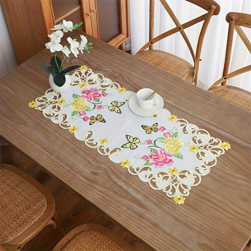 Elegant polyester table runner with hand-cut embroidered flowers and butterflies, perfect for home decor, restaurants, picnics, and parties. White base with vibrant floral patterns.