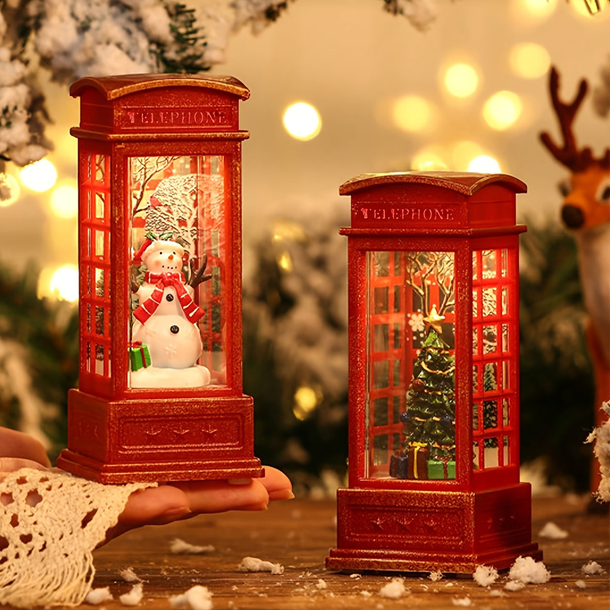 Festive Christmas phone booth decoration featuring Santa, snowman, and tree scenes. Battery-operated with illuminated red cabinet for holiday display.