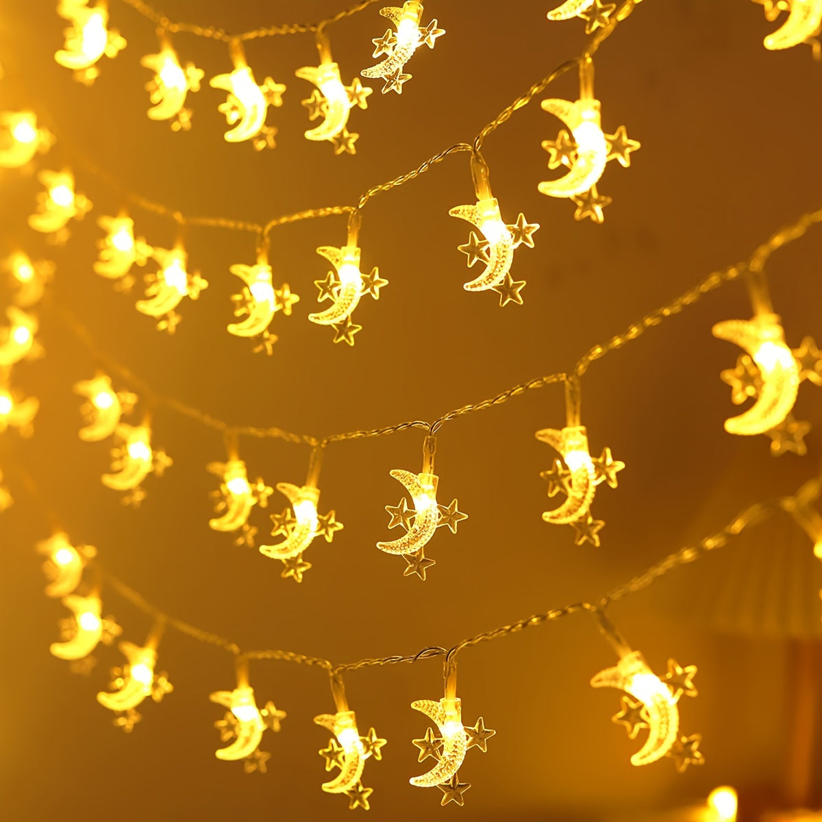 Battery powered star and moon light string for home decor, suitable for various festive decorations.