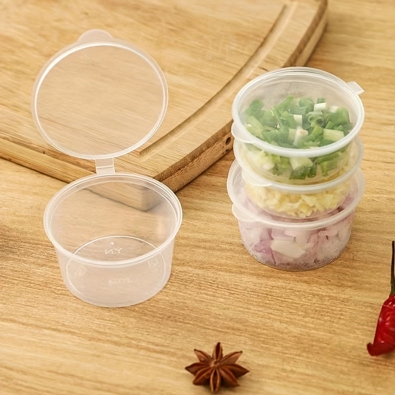 50 transparent disposable sauce boxes for takeout, packaging, and seasoning. These multipurpose food storage boxes come with covers.