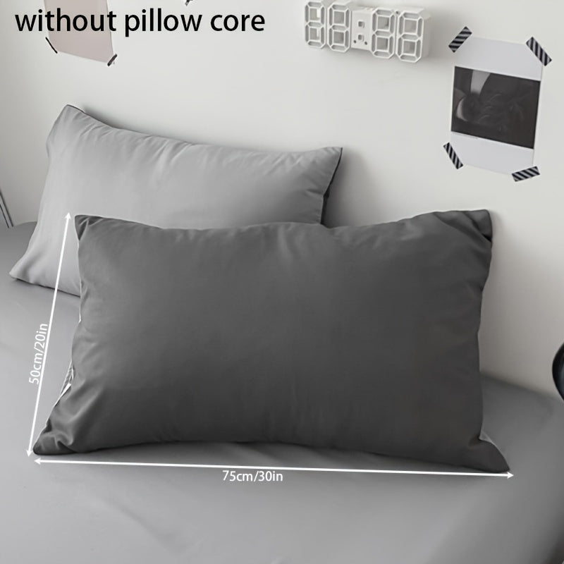 Get two ultra-soft brushed polyester pillowcases, weighing 90g each in a sleek light purple color. These rectangular pillowcases measure 50.8x76.2cm and feature an envelope closure. They are machine washable and perfect for adding cozy comfort to your