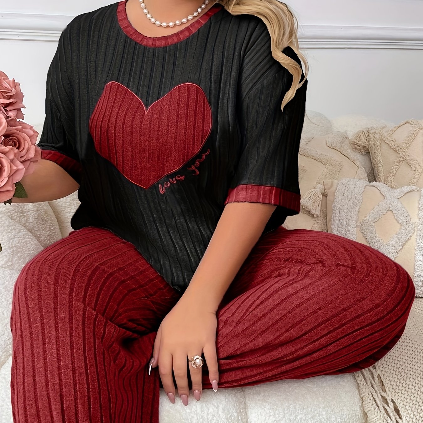 Cozy heart embroidered pajama set in plus size, includes short sleeve top and long pants made of soft polyester. Machine washable.