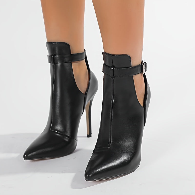 Stylish ankle bootie with buckle closure, pointed toe stiletto heel, rubber sole, and fabric insole. Made in Huizhou.