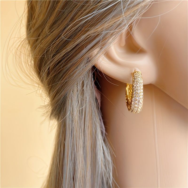 Vintage-style golden hoop earrings with sparking zirconia inlays, crafted from copper material, make a sophisticated and elegant gift for women.