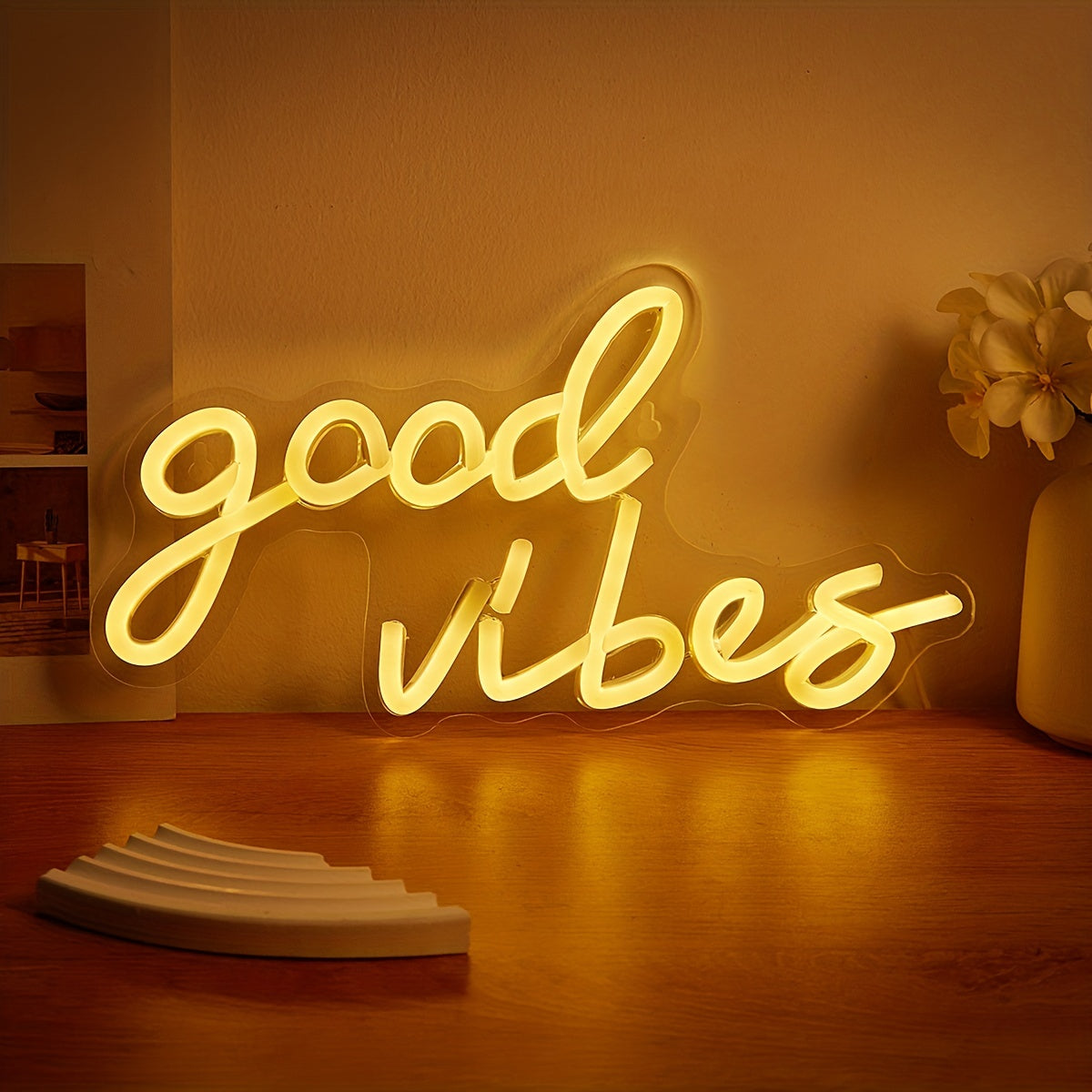 Pink cursive "Good Vibes" LED neon sign, USB powered for wall decor in bedroom, bar, or party atmosphere.