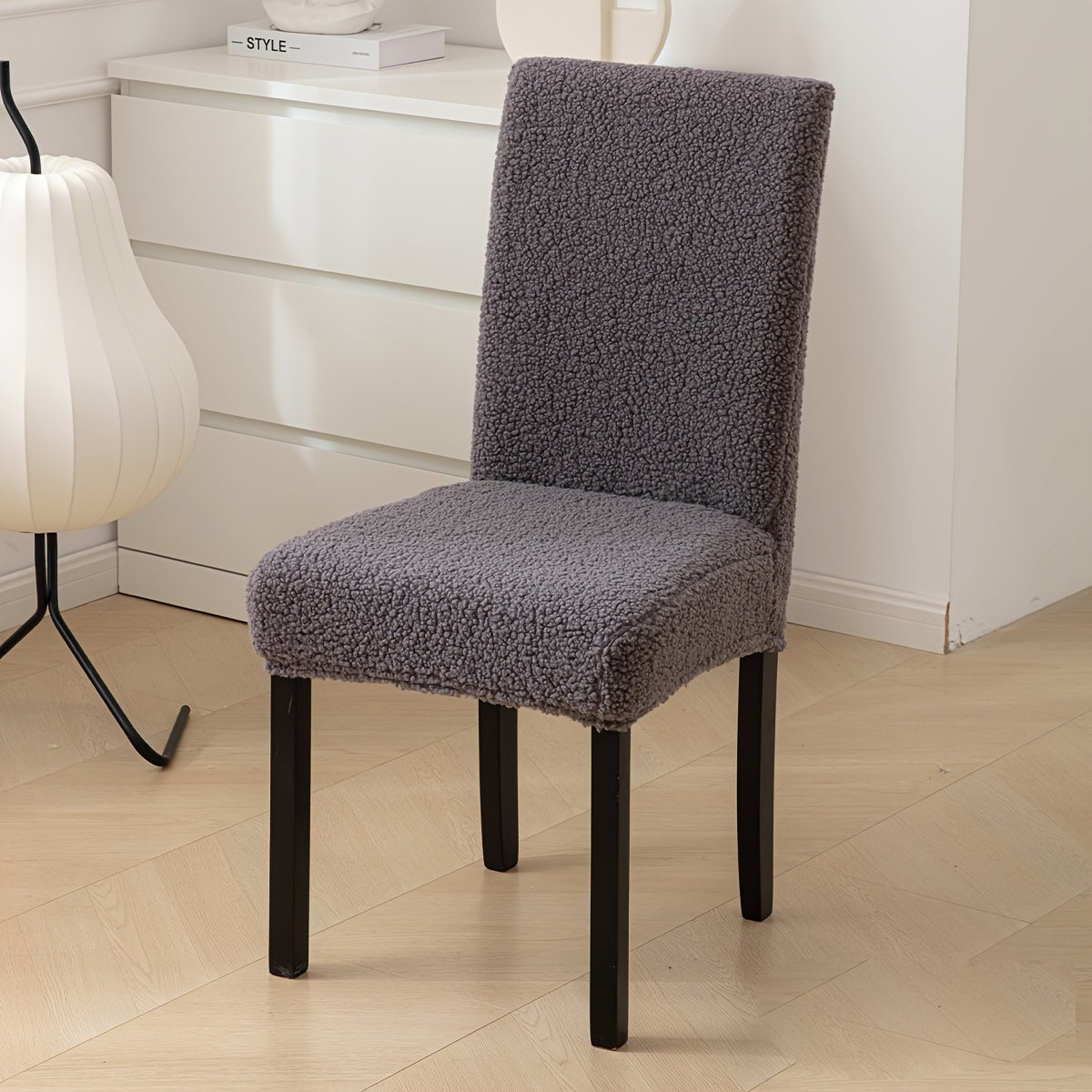 Stretch Sherpa chair cover with removable elastic slipcover, pet-friendly and machine washable. Made with a polyester and spandex blend, designed for home, restaurant, office, or banquet use. Available in multiple colors.