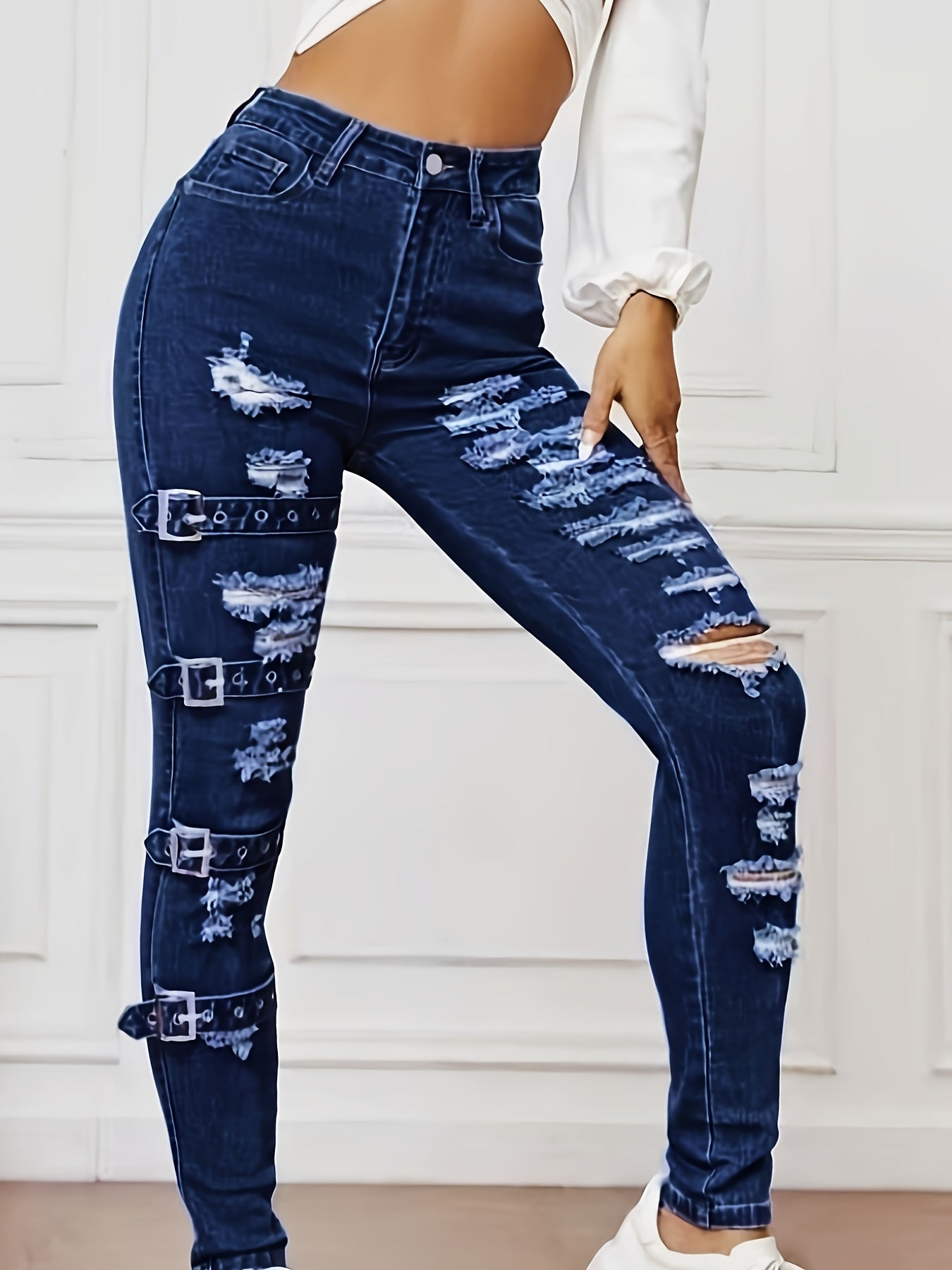 High-waisted denim jeans for women with ripped knees, stretch fabric blend, versatile fit for all seasons, machine washable.