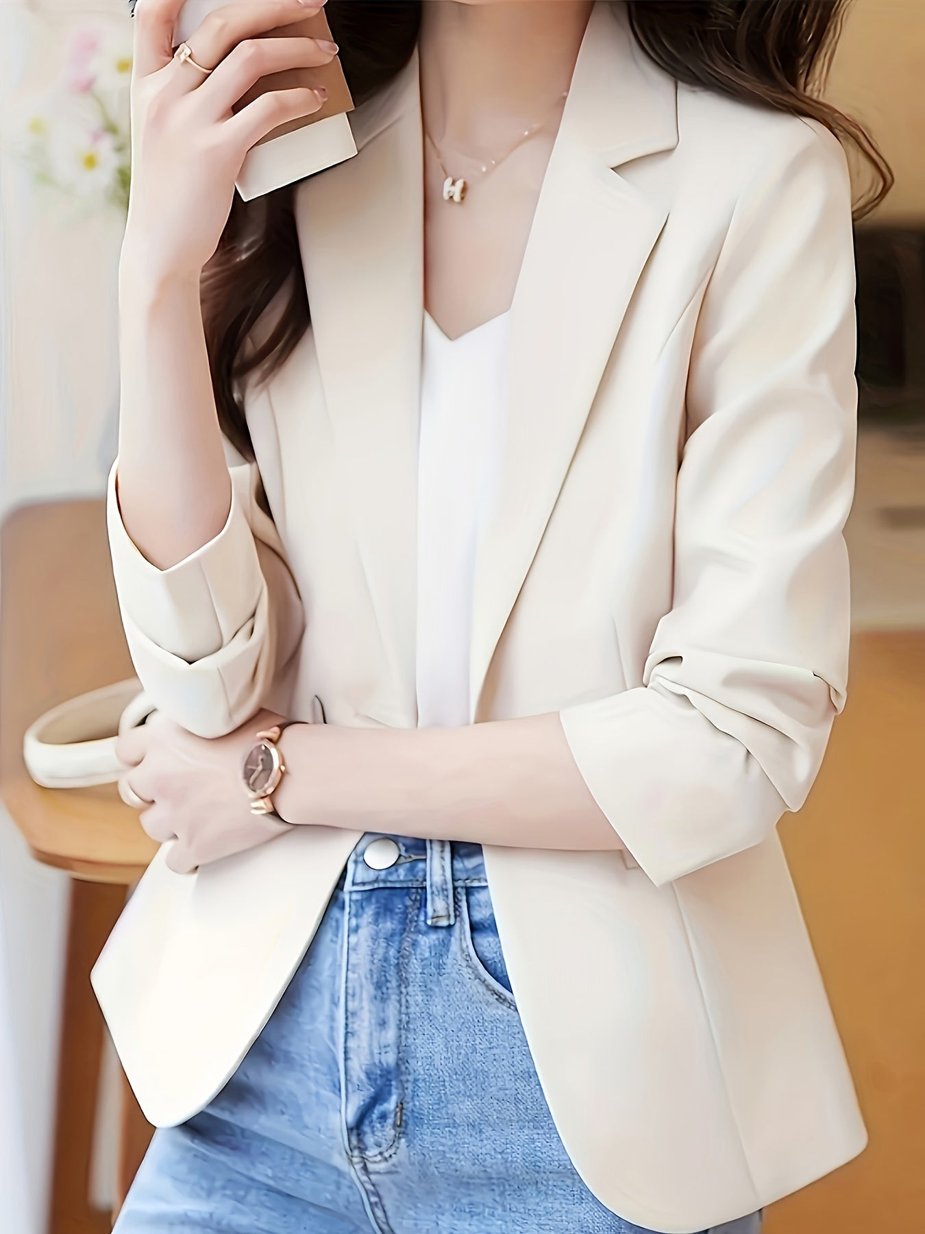 Women's stylish beige blazer with single button closure, long sleeves, slim fit, notch collar, perfect for spring/fall. Casual attire made of polyester.